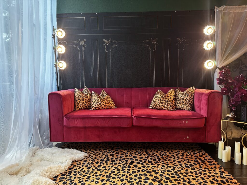 Dallas Fort Worth Denton Texas boudoir studio pink velvet couch leopard rug and pillows with dramatic lighting